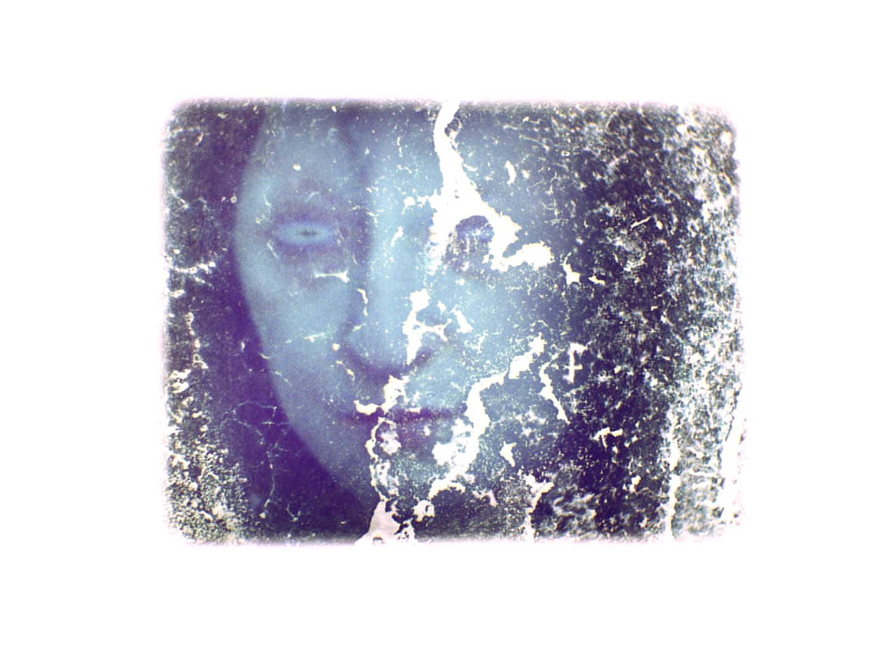 Entierro: Luz subterránea — a face emerging through decayed celluloid